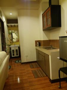 a kitchen with a sink and a counter top at 722 Metropolis Tower Unit 212 in Bacolod