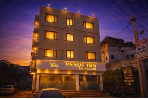 a building with a sign that reads venus innsbruck at Hotel venus inn sajjangarh in Udaipur