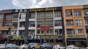 a hotel with cars parked in front of it at Clover Hotel in Johor Bahru