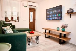 a living room with a couch and a table at Casa di Fava in Agios Nikolaos