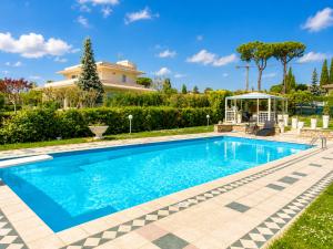 a swimming pool in the yard of a house at La Dolce Vita - Private Villa with Pool in Moniga