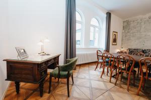 a dining room with a table and chairs at Rilke Apartments in Linz