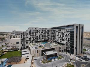an overhead view of a large building with a street at Novotel Dhahran Hotel & Residences in Dhahran