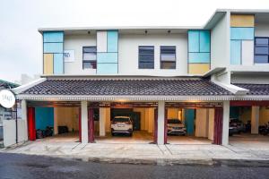 a building with a car parked inside of it at Sans Hotel Beskalan Malioboro in Yogyakarta +45 photos