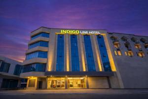 a building with a sign on top of it at IndiGo Line Hotel - Banjara Hills X Beside Paradise Biryani in Hyderabad
