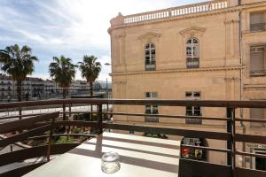 a view from the balcony of a building at Hôtel Colisée-Verdun Centre Gare Saint-Roch in Montpellier