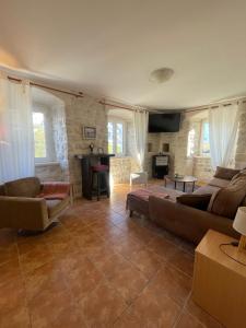 a living room with a couch and a table at Villa Old Mariner in Kotor