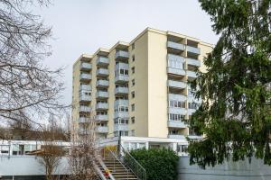 an apartment building with stairs in front of it at Ferienwohnung Alex in Meersburg