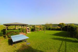 a backyard with a swing set and a playground at Podere Cerretini in Montepulciano