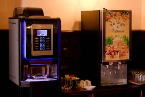 a pay phone is next to a cash machine at Metropol Hotel in Calais