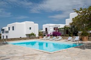 a swimming pool in front of a villa at Ibiscus down town location Myconos in Megali Ammos