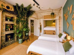a room with two beds and a fireplace at Otium Old Town Boutique in Krakow