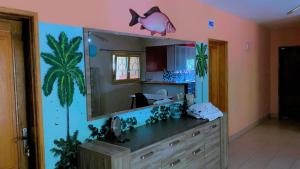 a bathroom with a sink and a large mirror at Samba immo chez Mbaye in Fatick