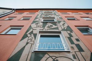 a building with a painting on the side of it at The Haus HANS Nuremberg in Nuremberg