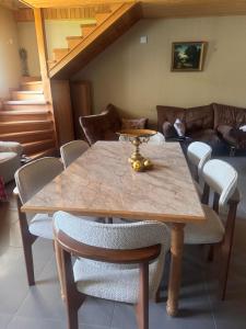 a dining room with a table and chairs at Guesthouse Lasili in Mestia in Mestia