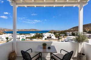 a view from the balcony of a house with a table and chairs at Danа̃e Sun&Sea Stays in Livadi