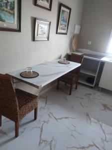 a dining room with a table and two chairs at Casa Colón en la mancha in Herencia
