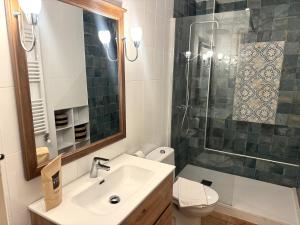 a bathroom with a toilet and a sink and a shower at Villa Monturiol in Llafranc +31 photos