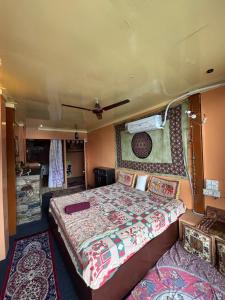 a bedroom with a large bed in a van at Om Guesthouse in Rishīkesh