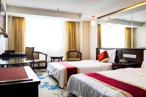 Letto o letti in una camera di New World Hotel