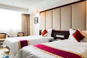 Letto o letti in una camera di New World Hotel