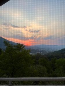 a view of the sunset from the top of a hill at Relax home in Travnik +4 photos