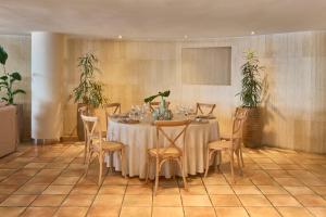 a dining room with a table and chairs at Barceló Illetas Albatros - Adults Only in Illetas +107 photos