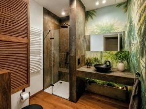 a bathroom with a sink and a shower at Otium Old Town Boutique in Krakow