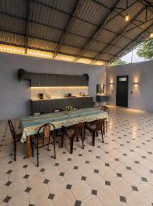 a large dining room with a large table and chairs at Hillside villa in Gabala