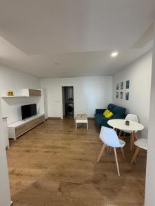 a living room with a couch and a table at El Gabal in Soto de la Marina