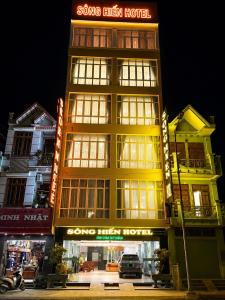 a building with a sign on top of it at Mama Cao Bang Hotel in Cao Bằng