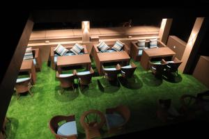 an overhead view of a restaurant with tables and chairs at Hotel Rich Comfort Ajmer in Ajmer