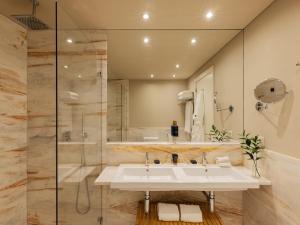 a bathroom with a sink and a shower at Pestana Vintage Porto Hotel & World Heritage Site in Porto +62 photos