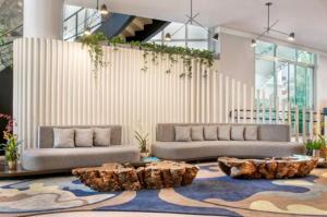 a living room with two couches and a rug at Hotel ML Jardim Europa Itaim UH-303 in São Paulo