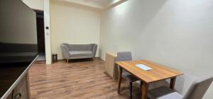 a conference room with a table and chairs and a chair at Hotel Asopalav in Junagadh
