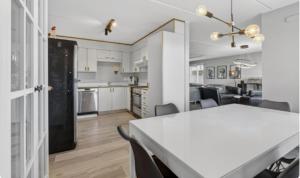 a kitchen and living room with a table and chairs at Large apartment in Reykjanes in Ytri-Njarðvík