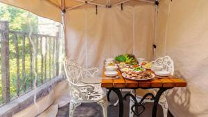 a table with a plate of food on a balcony at Wonju Healing Forest in Wonju