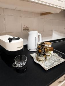 a kitchen counter with a mixer and bowls on it at Panora House in Kefalos