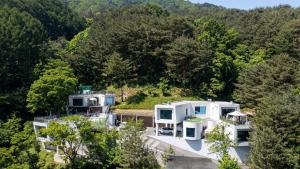 an aerial view of a house in the woods at Wonju Healing Forest in Wonju