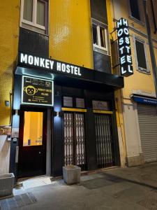 a monkey hostel sign on the front of a building at Monkey Hostel Milano in Milan