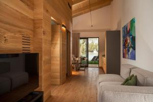 a living room with a couch and a fireplace at The Village Chalet in Castel di Sangro