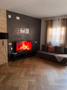 a living room with a couch and a fireplace at 3-Bedroom Home, Free Parking,10 Minutes from Seville in Camas