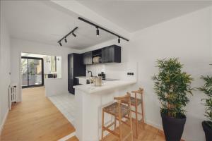 a kitchen and living room with a counter and stools at Yacht La Maison in Fethiye +3 photos