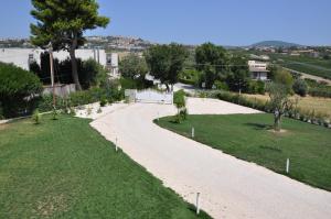 an overhead view of a driveway with grass and trees at Dolce Conero Guest House in Camerano