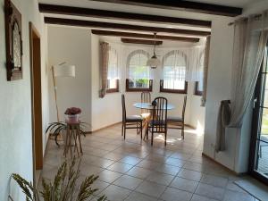 a kitchen and dining room with a table and chairs at Ferienhaus Barth in Bad Salzungen