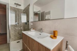 a bathroom with a sink and a shower at My Tuscany Pink Suite in San Quirico dʼOrcia