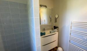 a bathroom with a sink and a mirror at Côté gartempe in Les Hermitières +14 photos