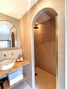 a bathroom with a sink and a shower at Château Hôtel La Terrasse - Teritoria in Meyronne +58 photos
