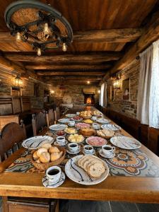 a long table with plates of food on it at Casa de Aira Padron  +15 photos
