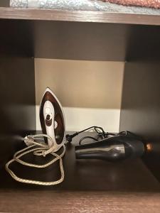 a light on a shelf with a cord plugged into it at Villa hills II in Yerevan